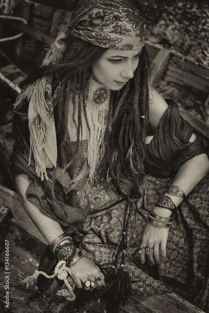 gypsy style young woman in boat