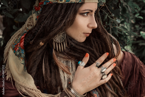 close up of gypsy style woman outdoors photo