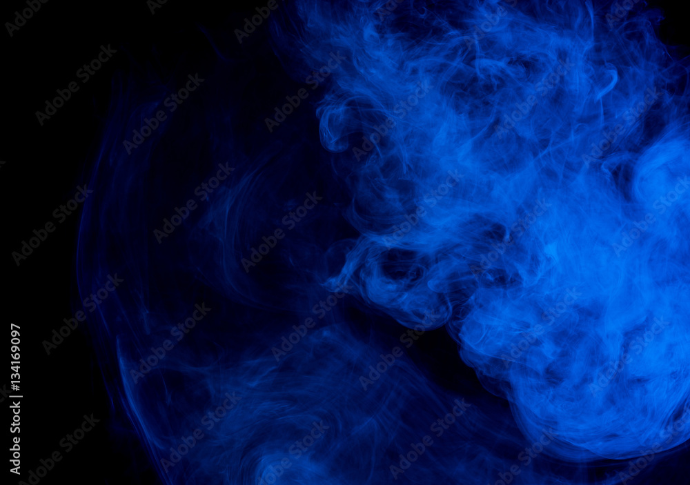 Abstract smoke Weipa. Personal vaporizers fragrant steam. The concept of alternative non-nicotine smoking. Blue smoke on a black background. E-cigarette. Evaporator. Taking Close-up. Vaping. Abstract smoke Weipa. Personal vaporizers fragrant steam. The concept of alternative non-nicotine smoking. Blue smoke on a black background. E-cigarette. Evaporator. Taking Close-up. Vaping.