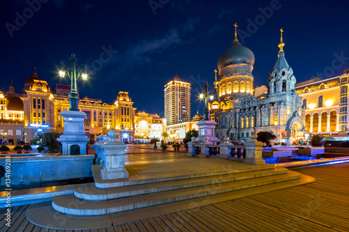 famous harbin sophia cathedral at night from square photo