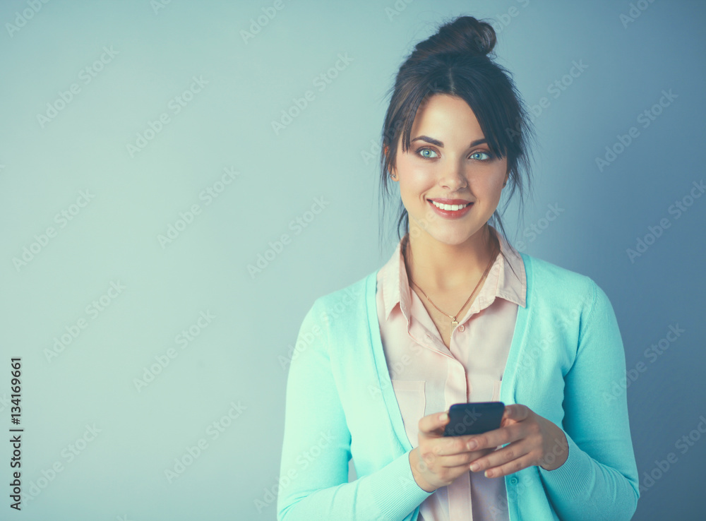 Woman using and reading a smart phone Woman using and reading a smart phone