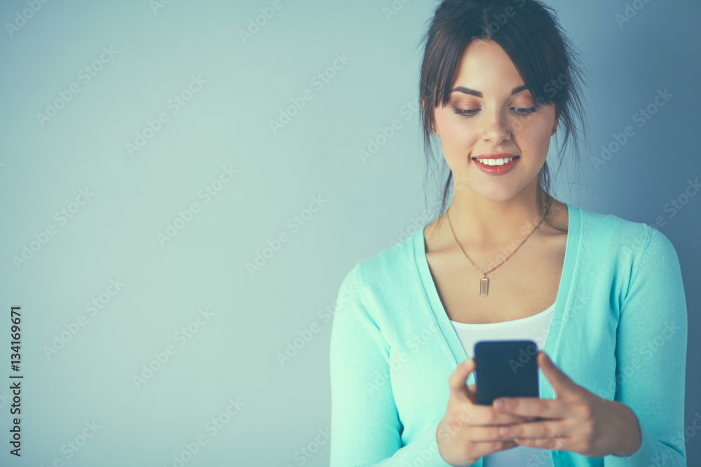 Woman using and reading a smart phone Woman using and reading a smart phone