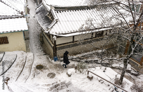 tourist walking down bukchon hanok photo