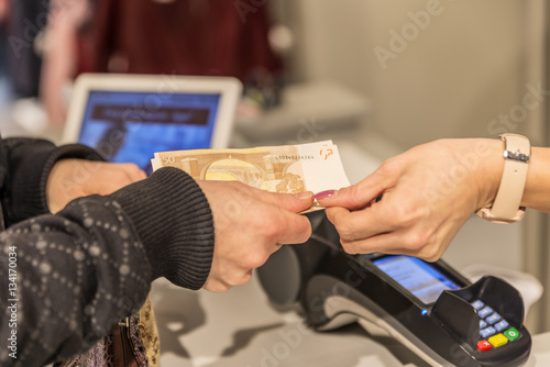 Buying goods in the store, the buyer transfers money to the seller