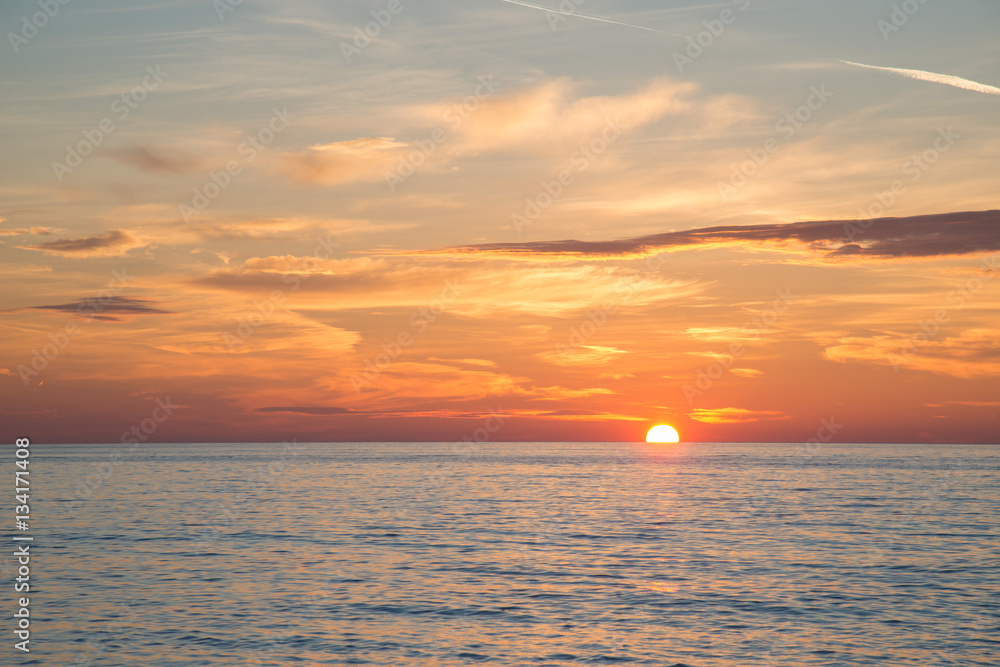 Fototapeta premium Beautiful burning sky at sunrise beach in the morning time
