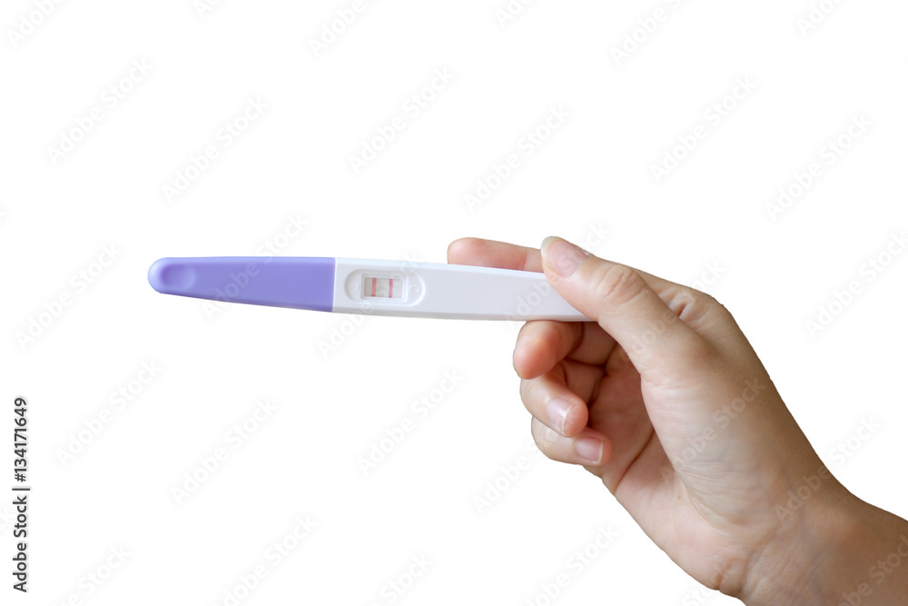 woman hand holding a positive pregnancy test on white background woman hand holding a positive pregnancy test on white background