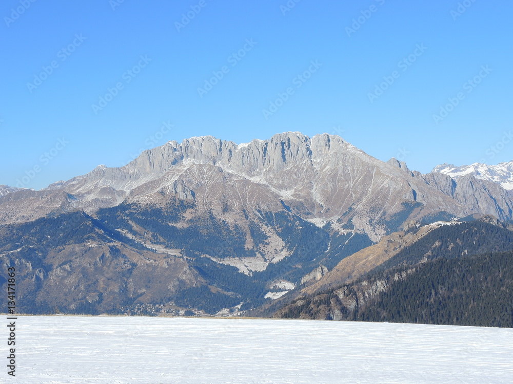 Wonderful panorama from Monte Pora to Presolana in winter dry season. Orobie Prealps, Bergamo, Lombardy, Italy.