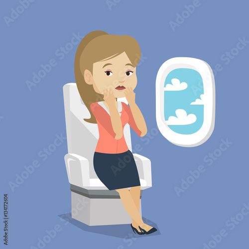 Young woman suffering from fear of flying.