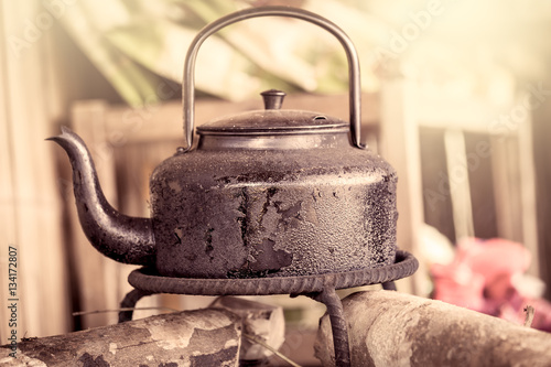 tea kettle on stove in vintage color filter