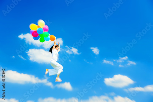 Woman Flying With Colorful Balloons
