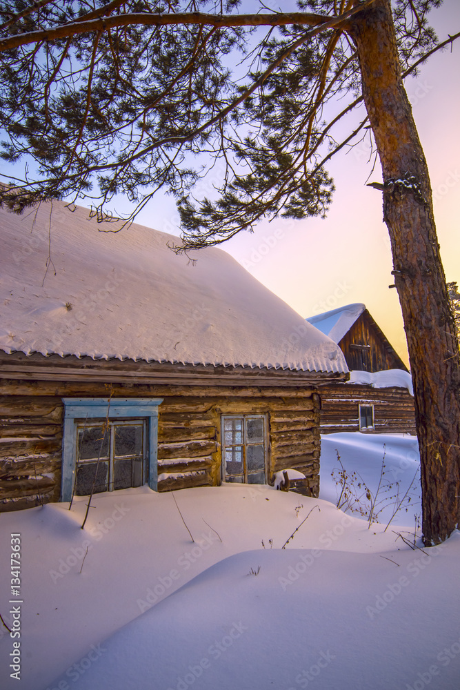 vertical background with abandoned cabin covered by snow under o