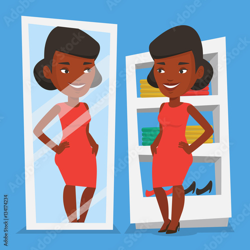 Woman trying on clothes in dressing room.