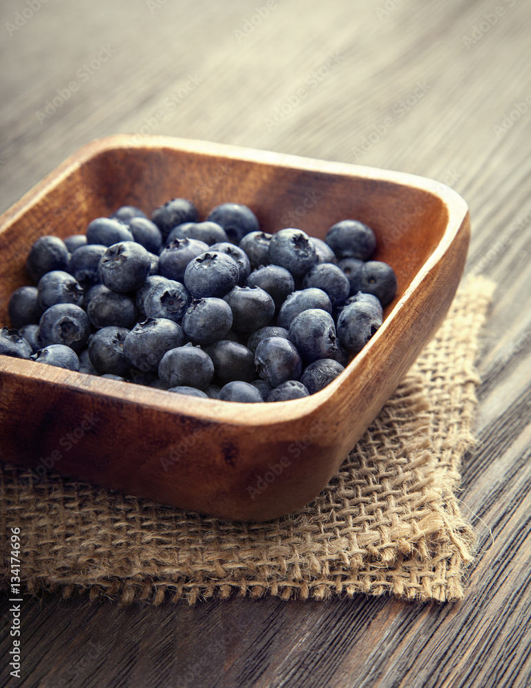 ripe sweet blueberries on wooden table