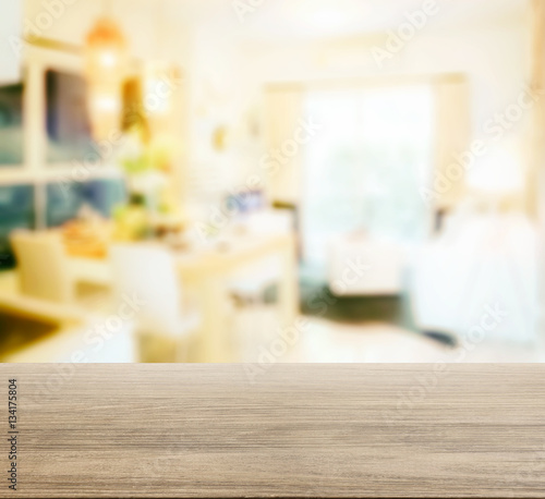 wooden table top with blur of dining table in modern dining room © worldwide_stock