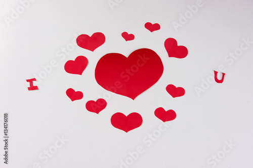 Red hearts on a white background. Love card concept, Valentine's day theme. Shot from above