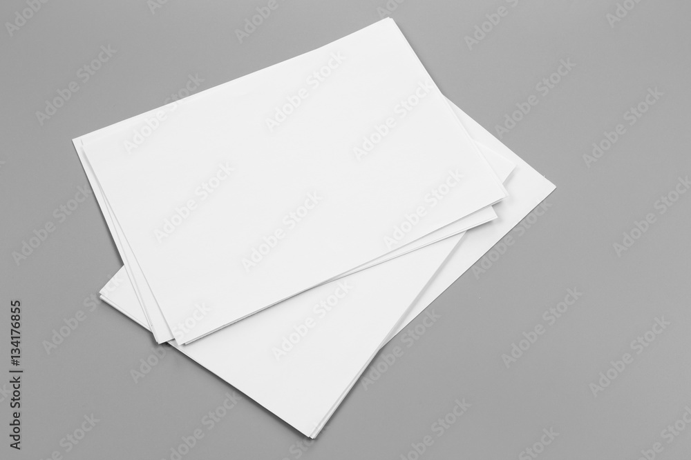 Blank portrait A4. brochure magazine isolated on gray, changeable background / white paper isolated on gray Blank portrait A4. brochure magazine isolated on gray, changeable background / white paper isolated on gray