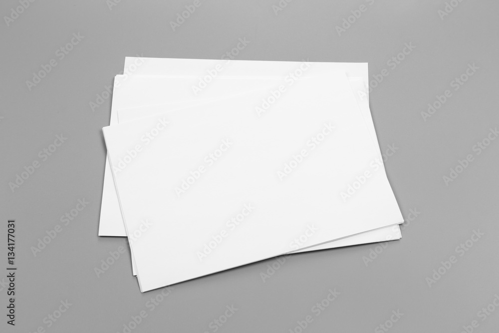 Blank portrait A4. brochure magazine isolated on gray, changeable background / white paper isolated on gray Blank portrait A4. brochure magazine isolated on gray, changeable background / white paper isolated on gray