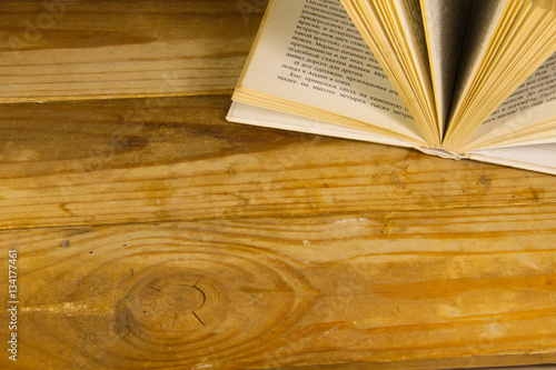 Open book on wooden desk
