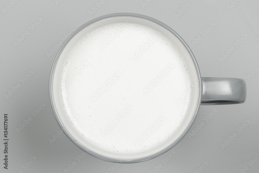 top view of glass milk / Glass of Milk From Above / gray tone top view of glass milk / Glass of Milk From Above / gray tone