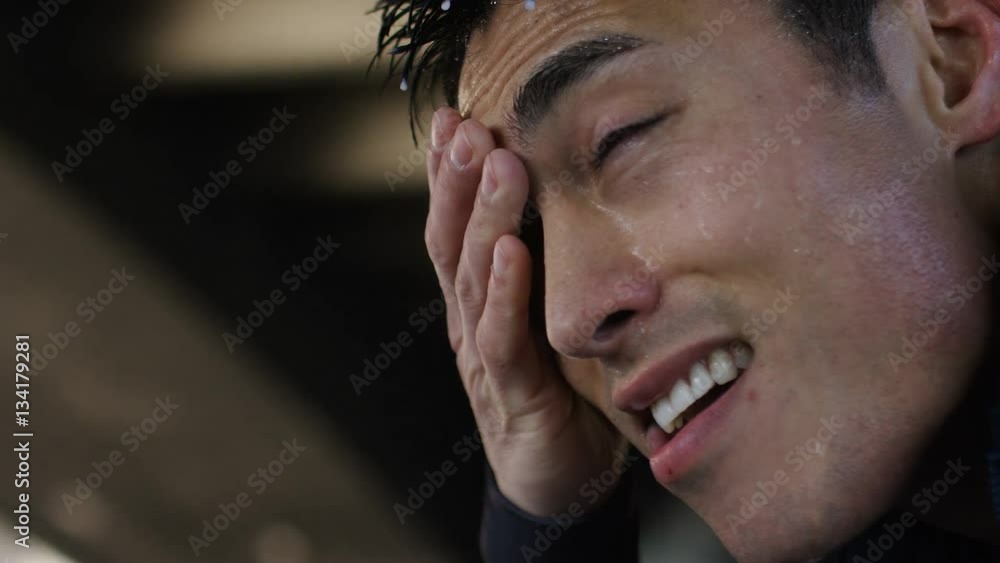 4K Young asian athlete sweating after a workout in the city, in slow motion 4K Young asian athlete sweating after a workout in the city, in slow motion