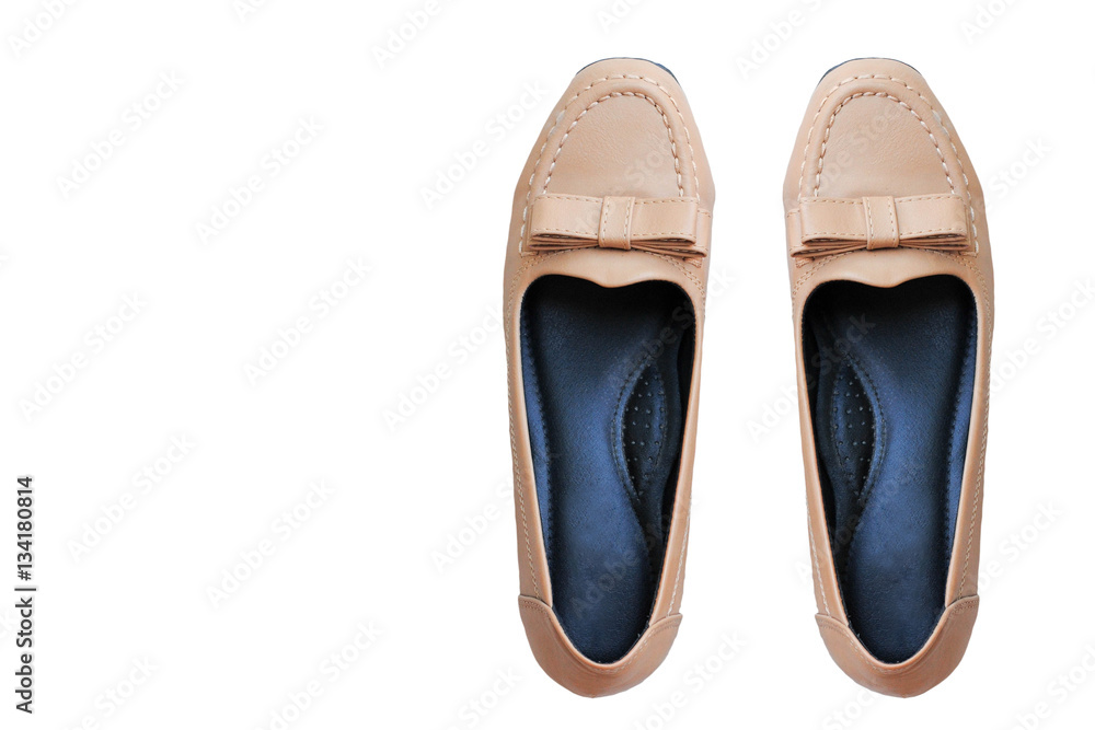 Female brown shoes on a white background.
Female brown shoes on a white background.