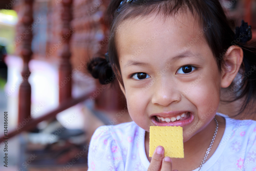 Asian child girl Eating Biscuit Asian child girl Eating Biscuit
