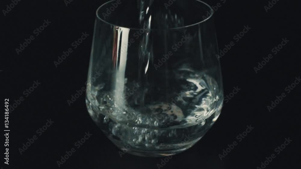 Pouring drink into a glass Pouring drink into a glass