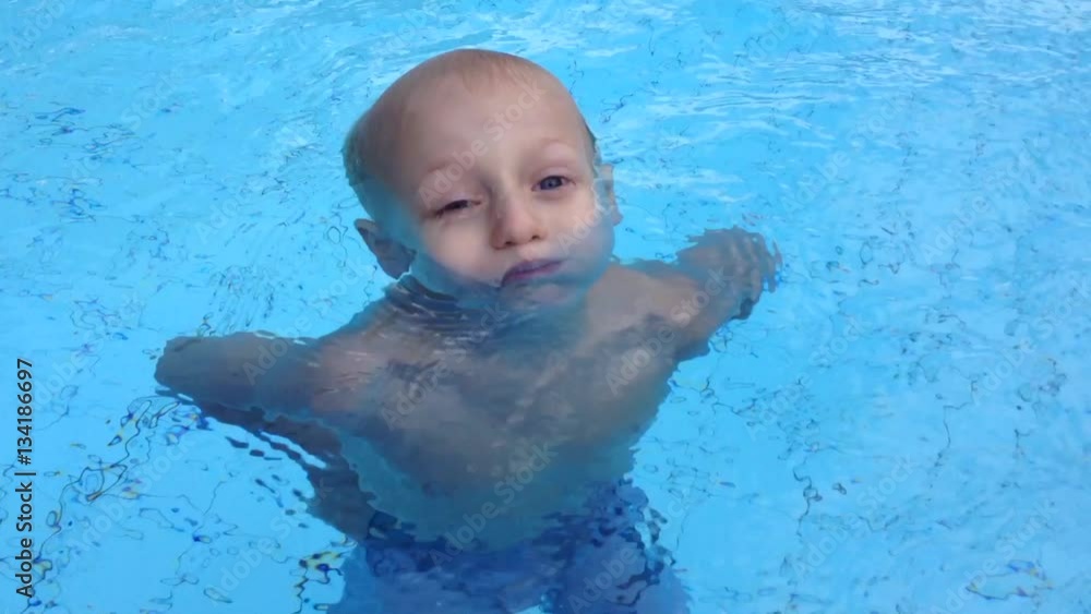 kid swimming in the pool kid swimming in the pool