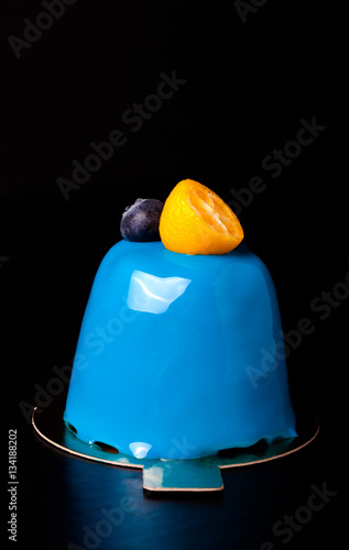 Blue mousse cake with berries, fruit and chocolate