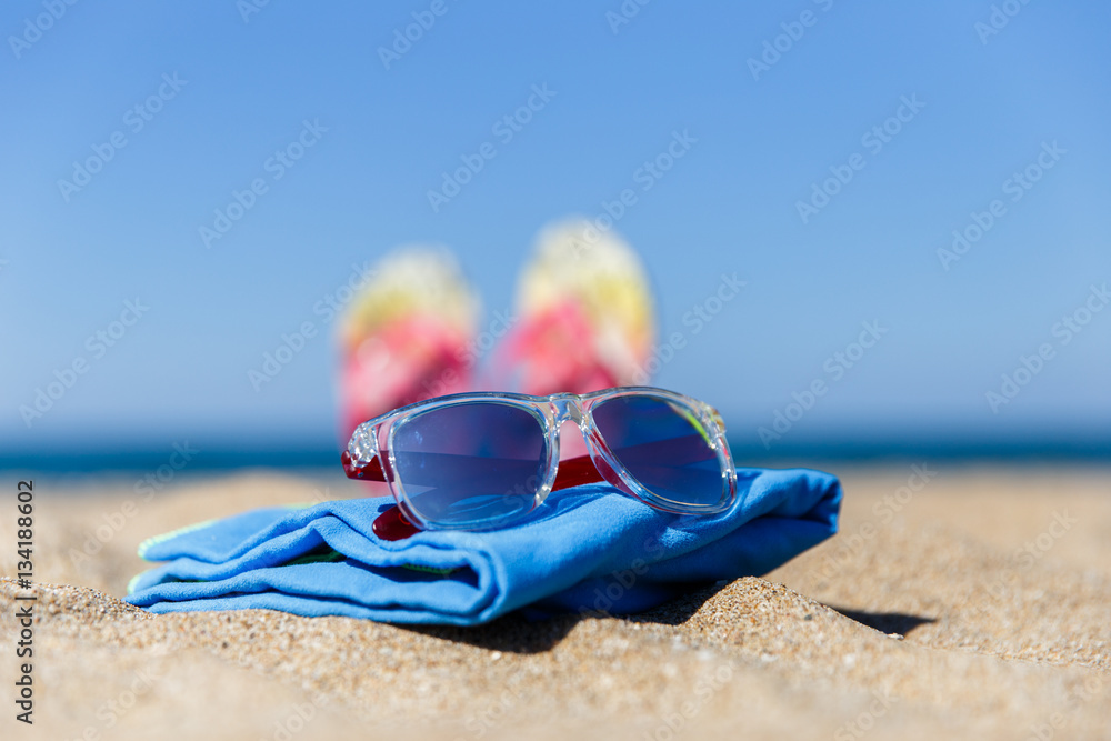 Coast with sunglasses on plaid