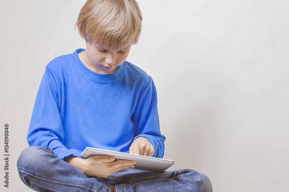 Fototapeta premium Child using digital tablet computer
