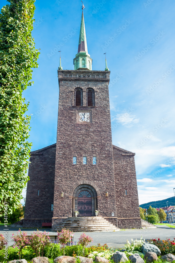 Fototapeta premium Front facade exterior of a small stone built Scandinavian church