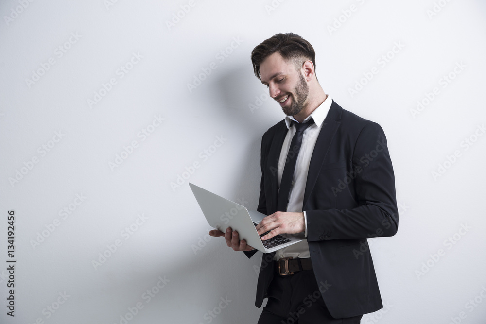 businessman holding a laptop