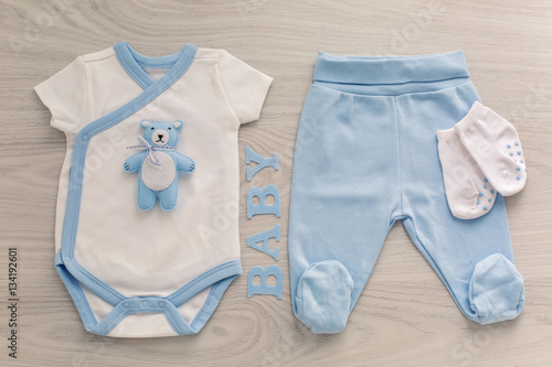 bodysuit and pants newborn socks and a toy bear © saulich84