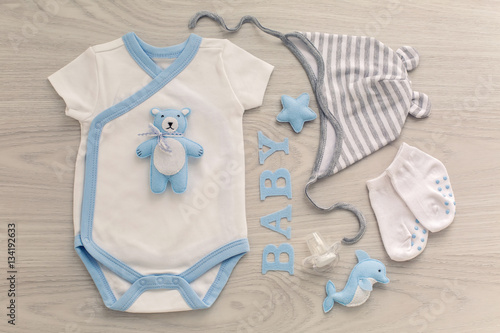 bodysuit and pants newborn socks and a toy bear