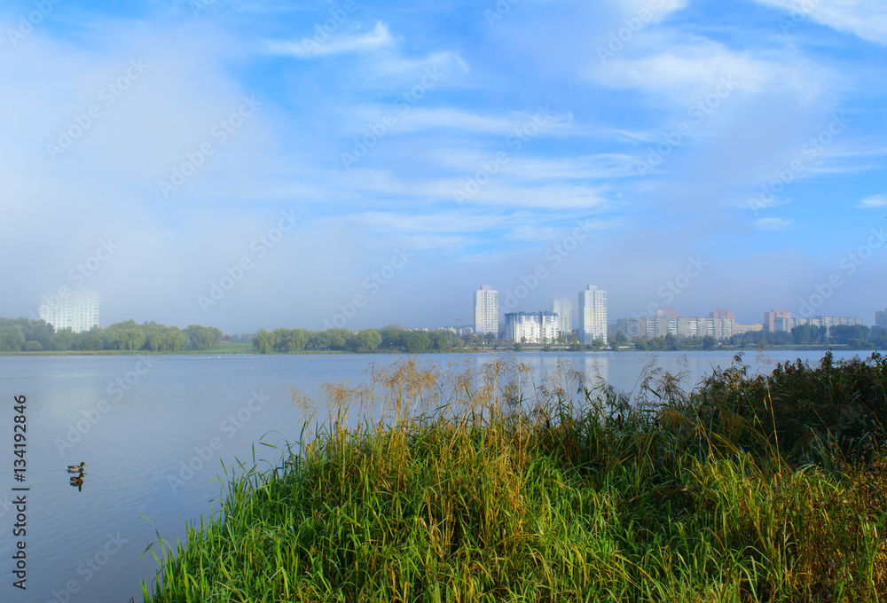 Fog over pond Chizhovsky reservoir, the city of Minsk, Belarus, October, autumn, morning,
