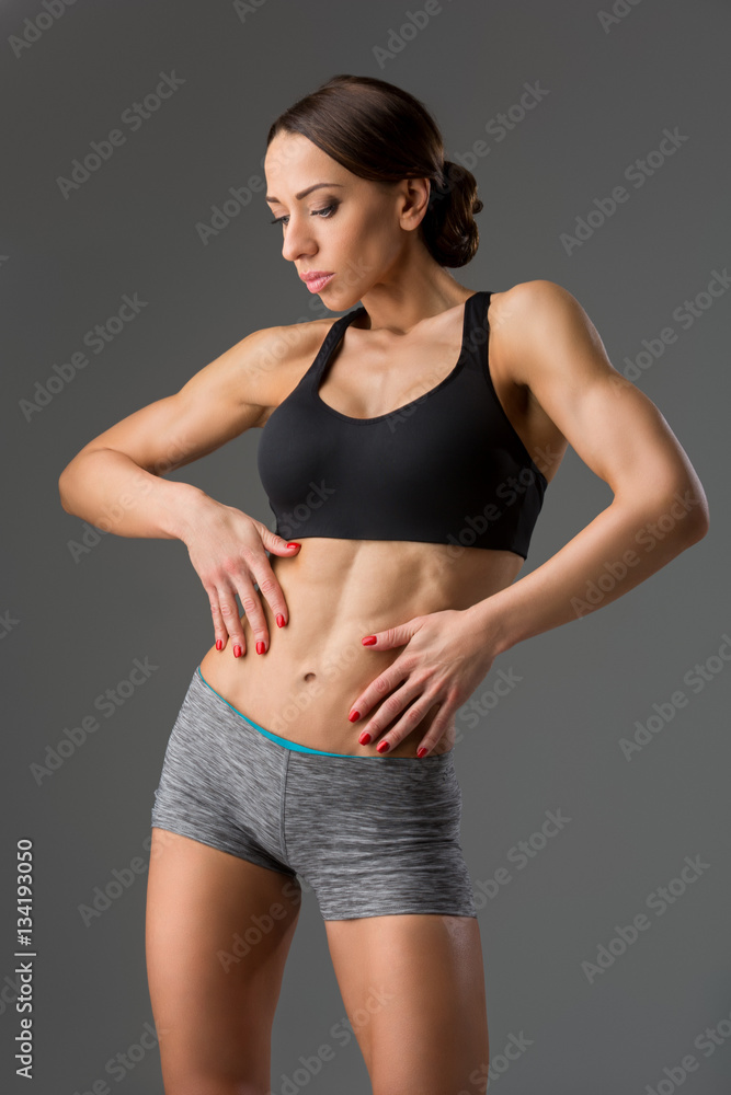 Beautiful fit girl in sport bra and shorts Beautiful fit girl in sport bra and shorts