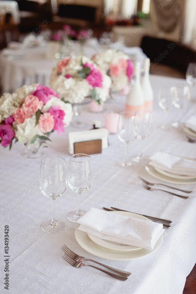Restaurant Served table for wedding, decorated with peony flowers Restaurant Served table for wedding, decorated with peony flowers