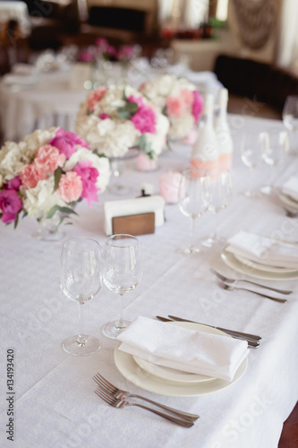 Restaurant Served table for wedding, decorated with peony flowers