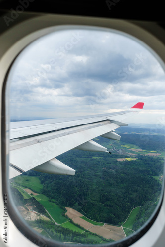 Aircraft wing during flight and landing from the window