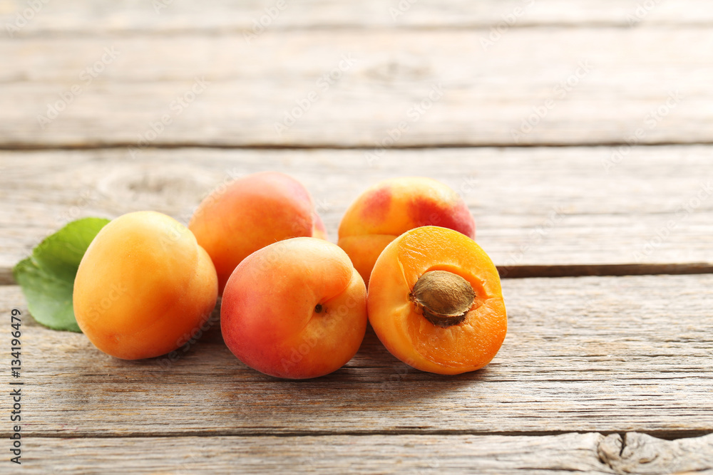 Ripe apricots fruit on grey wooden table Ripe apricots fruit on grey wooden table