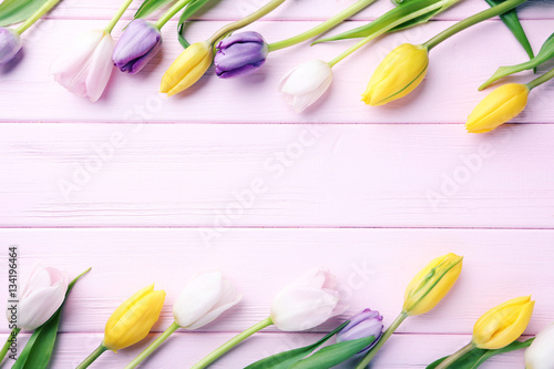 Bouquet of tulips on pink wooden table © 5second