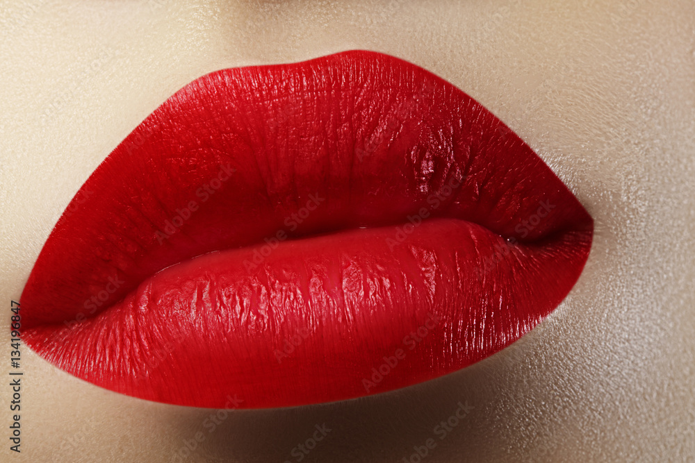 Beautiful female Lips. Sweet Kiss with red lipstick. Lip Make-up on macro shoot. Hot fashion lip makeup Beautiful female Lips. Sweet Kiss with red lipstick. Lip Make-up on macro shoot. Hot fashion lip makeup