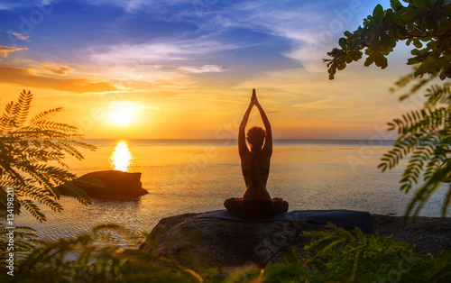 serenity and yoga practicing at sunset,meditation