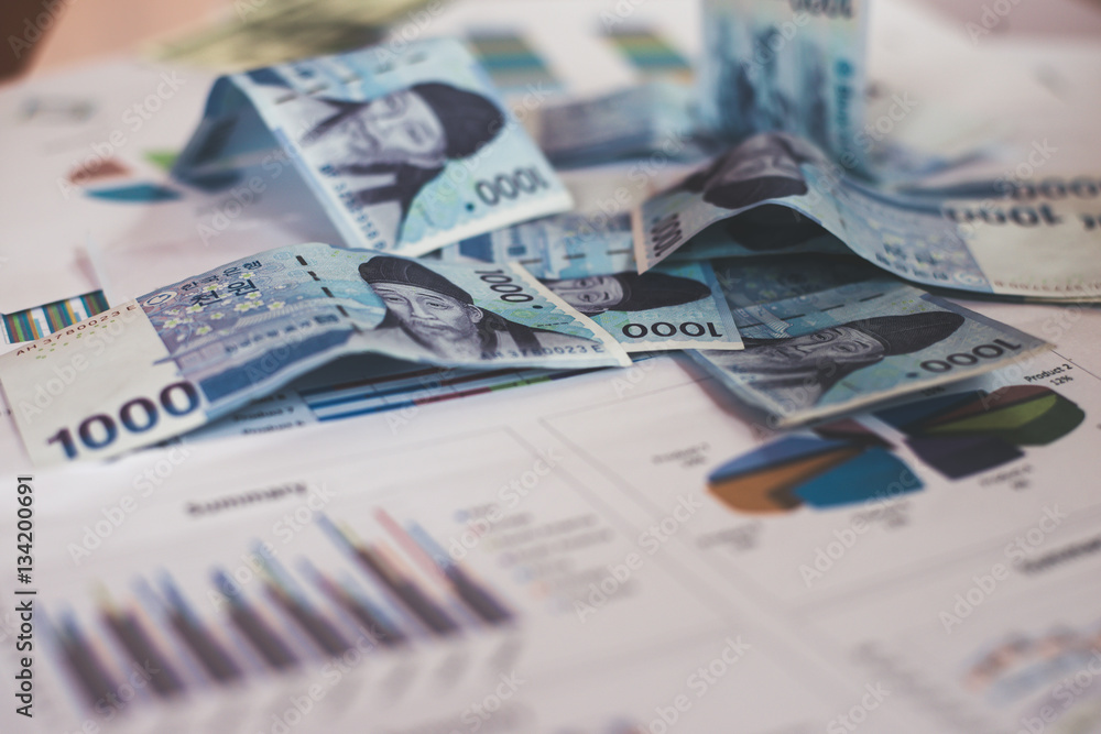 Business concept with money and documents graph on workplace. Business concept with money and documents graph on workplace.