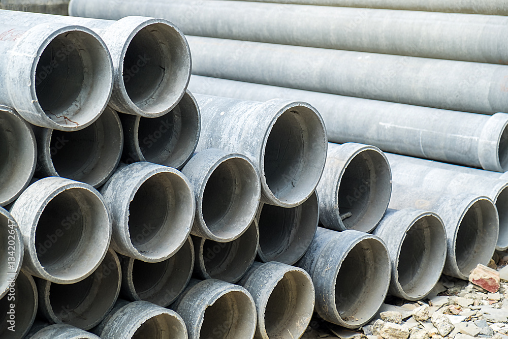 Stacked of Industrial concrete drainage pipes for construction Stacked of Industrial concrete drainage pipes for construction