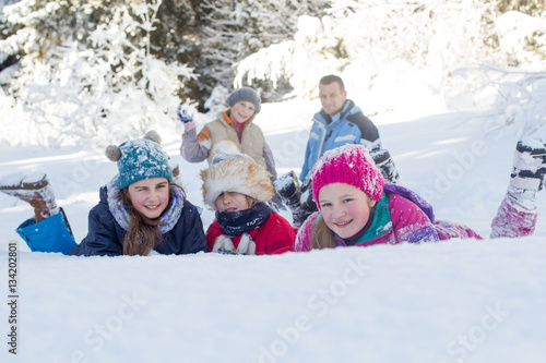Happy girls having fun with snow
