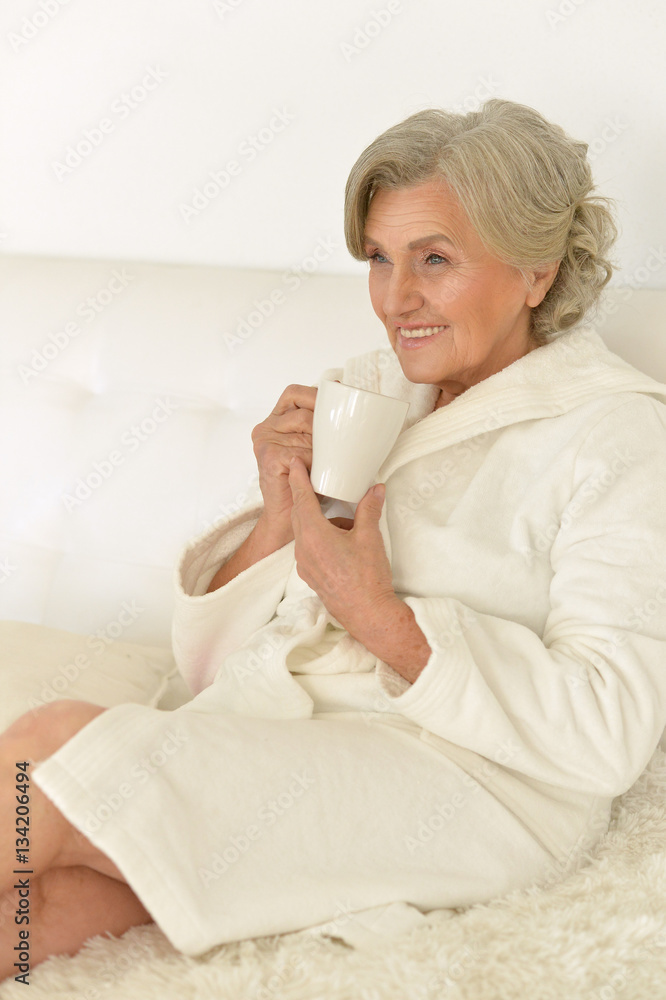 Seniour woman drinks tea