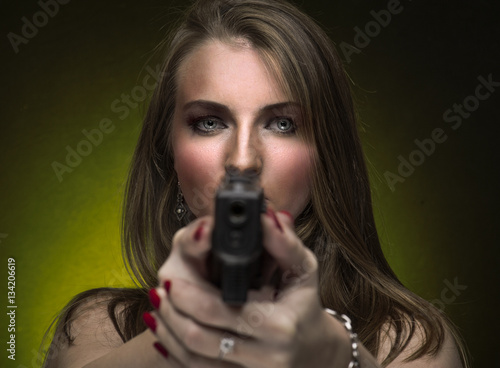 Woman holding two handguns