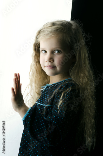 Beautiful portrait little girl in the studio 